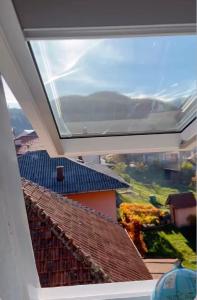 a view from a window of a roof at Apartman Nikola in Vlasenica +2 photos
