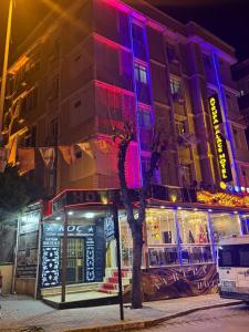 a building with red and blue lights on it at Avrupa Palace Hotel in Avcılar