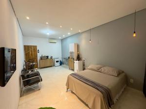 Et tv og/eller underholdning på Stúdio Prox Centro Garagem Privado