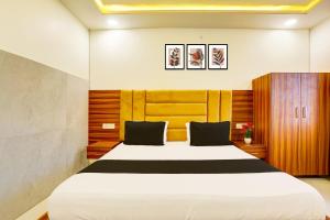 Giường trong phòng chung tại Hotel O Dev paradise