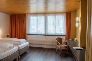 Postel nebo postele na pokoji v ubytování Hotel Garni Rösslipost