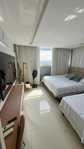 En eller flere senge i et værelse på Cobertura dúplex frente mar
