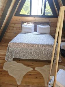a bedroom with a bed in a attic at YAKUT bungalow in Akyazı