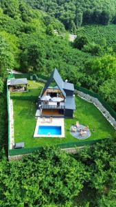 an aerial view of a house with a swimming pool at YAKUT bungalow in Akyazı