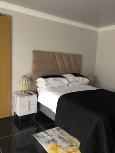 En eller flere senge i et værelse på Bonnie Guest house