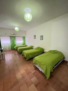 Giường trong phòng chung tại Complejo Ultramar