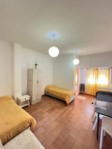 Giường trong phòng chung tại Complejo Ultramar