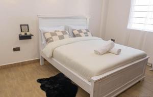 Giường trong phòng chung tại Mura Suites