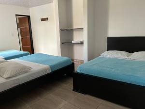 Postel nebo postele na pokoji v ubytování Hotel La Realeza