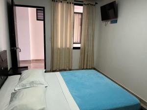 Postel nebo postele na pokoji v ubytování Hotel La Realeza