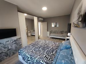 a bedroom with a zebra print bed in a room at Work & Relax Home in Paderno Dugnano