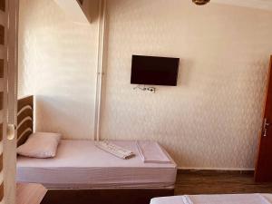 En eller flere senge i et værelse på yeni erciyes gold hotel