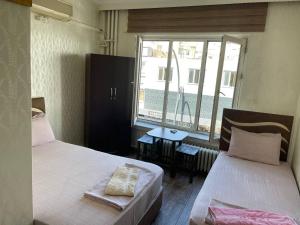 En eller flere senge i et værelse på yeni erciyes gold hotel