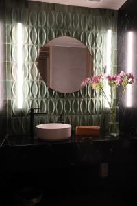 a bathroom with a sink and a mirror at Seven Crown La Paz Malecon in La Paz +46 photos