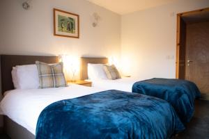 Postel nebo postele na pokoji v ubytování Stronsay Hotel