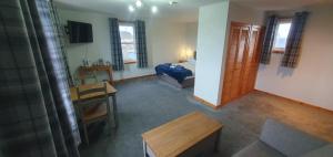 TV a/nebo společenská místnost v ubytování Stronsay Hotel