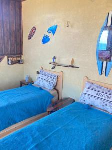 Postel nebo postele na pokoji v ubytování Hostel Mirleft