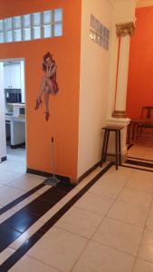 a painting of a woman on the wall in a room at Pin-up hostel in Rosario