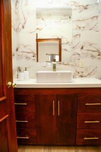a bathroom with a sink and a mirror at Casa Naranja in Ciudad Fernández +38 photos