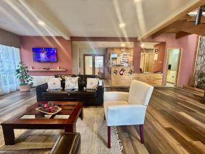 a living room with a couch and a table at Madero Aysen ApartHotel in Coihaique