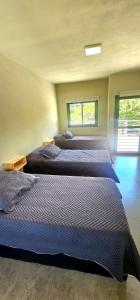 En eller flere senge i et værelse på Casa Privada Los Cardenales + 21 billeder