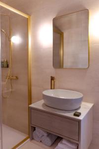 a bathroom with a sink and a mirror at Rooms at 32 in Sligo