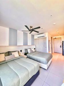 En eller flere senge i et værelse på Suite Vista a Reserva y Mar piso15 Bello Horizonte