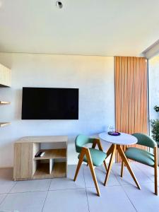 Et tv og/eller underholdning på Suite Vista a Reserva y Mar piso15 Bello Horizonte