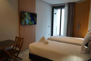 TV a/nebo společenská místnost v ubytování Agdotel Urban Suites