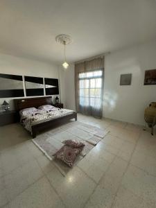 En eller flere senge i et værelse på Appart 2