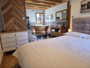 En eller flere senge i et værelse på Chalet Beaufort