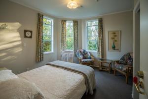 Postel nebo postele na pokoji v ubytování Lancewood Lodge