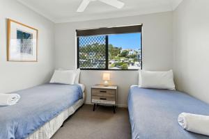 Postel nebo postele na pokoji v ubytování Unit 10 The Rocks