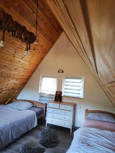 En eller flere senge i et værelse på Villa Madalina Blidinje