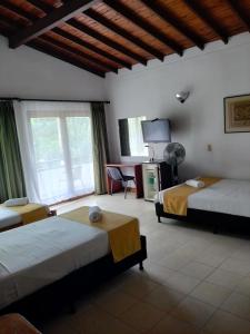 Ένα ή περισσότερα κρεβάτια σε δωμάτιο στο Hotel Balcones De Malibu