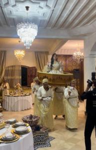 a group of people standing in a room with a woman at Welcome to Riad Glam Marrakech in Marrakesh
