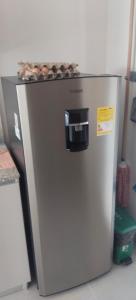 a small refrigerator with a counter top on top of it at Santa marina in Santa Marta