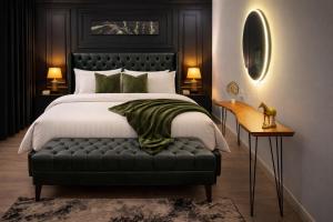 a bedroom with a large bed with a black headboard at Presidential Suite In Gold Crest Residency-DHA Phase 4 Lahore in Lahore