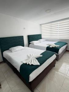 Postel nebo postele na pokoji v ubytování Hotel Hierbabuena y Restaurante + 21 fotografií