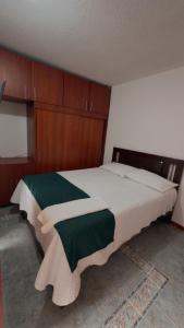 Postel nebo postele na pokoji v ubytování Hotel Hierbabuena y Restaurante