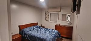 En eller flere senge i et værelse på Casita sostenible