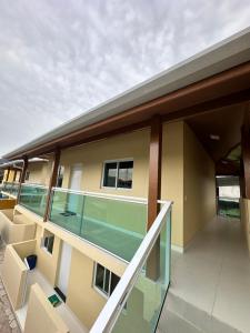 a view of a building with a balcony at Chalés Brisa Do Mar in São Sebastião