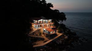 an aerial view of a house on the ocean at Casa Azul, Oceanfront Estate with Rooftop Deck in Yelapa