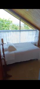 Postel nebo postele na pokoji v ubytování Mindo Suites