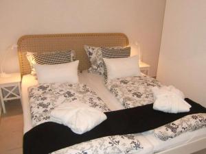 En eller flere senge i et værelse på Villa Näkel-Hardtberg