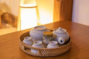a basket filled with pottery sitting on a table at Yangpyeong Evergrove in Yangpyeong