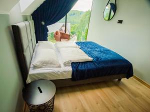 En eller flere senge i et værelse på A comfortable house in Kashubia for 4 people