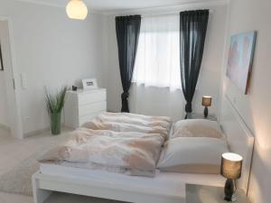 Ένα ή περισσότερα κρεβάτια σε δωμάτιο στο Moselle Castle View, Koblenz Dieblich