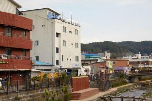 a view of a city with a building at Slowcruise in Gongju