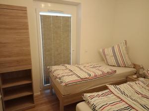 En eller flere senge i et værelse på Riverfront Kappeln